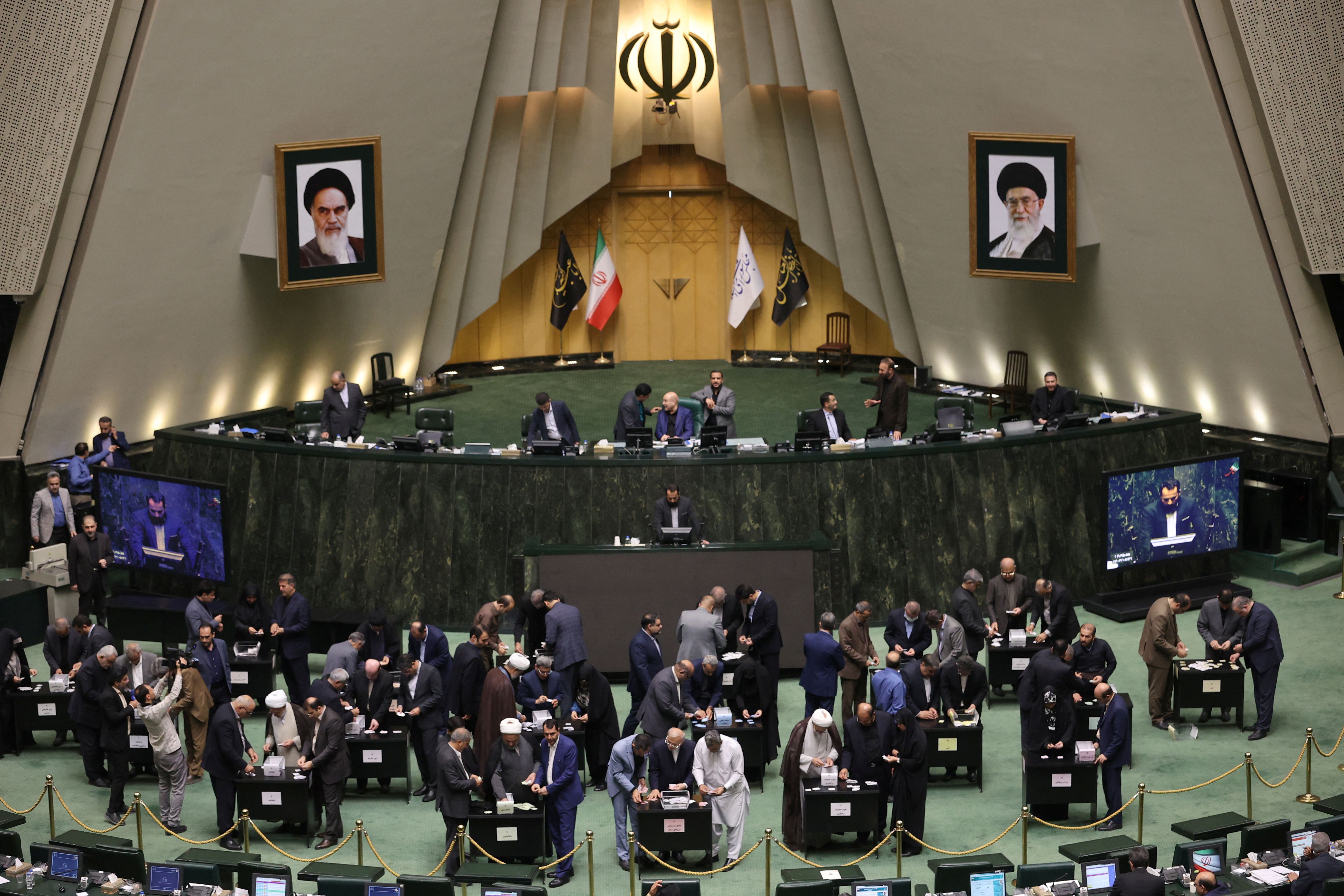 Members of the Iranian Parliament participate in a vote of trust for the cabinet of President Masoud Pezeshkian at the parliament in Tehran, Iran, August 21, 2024.