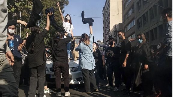 People chanting anti-regime slogans on streets during a protest rally in Tehran