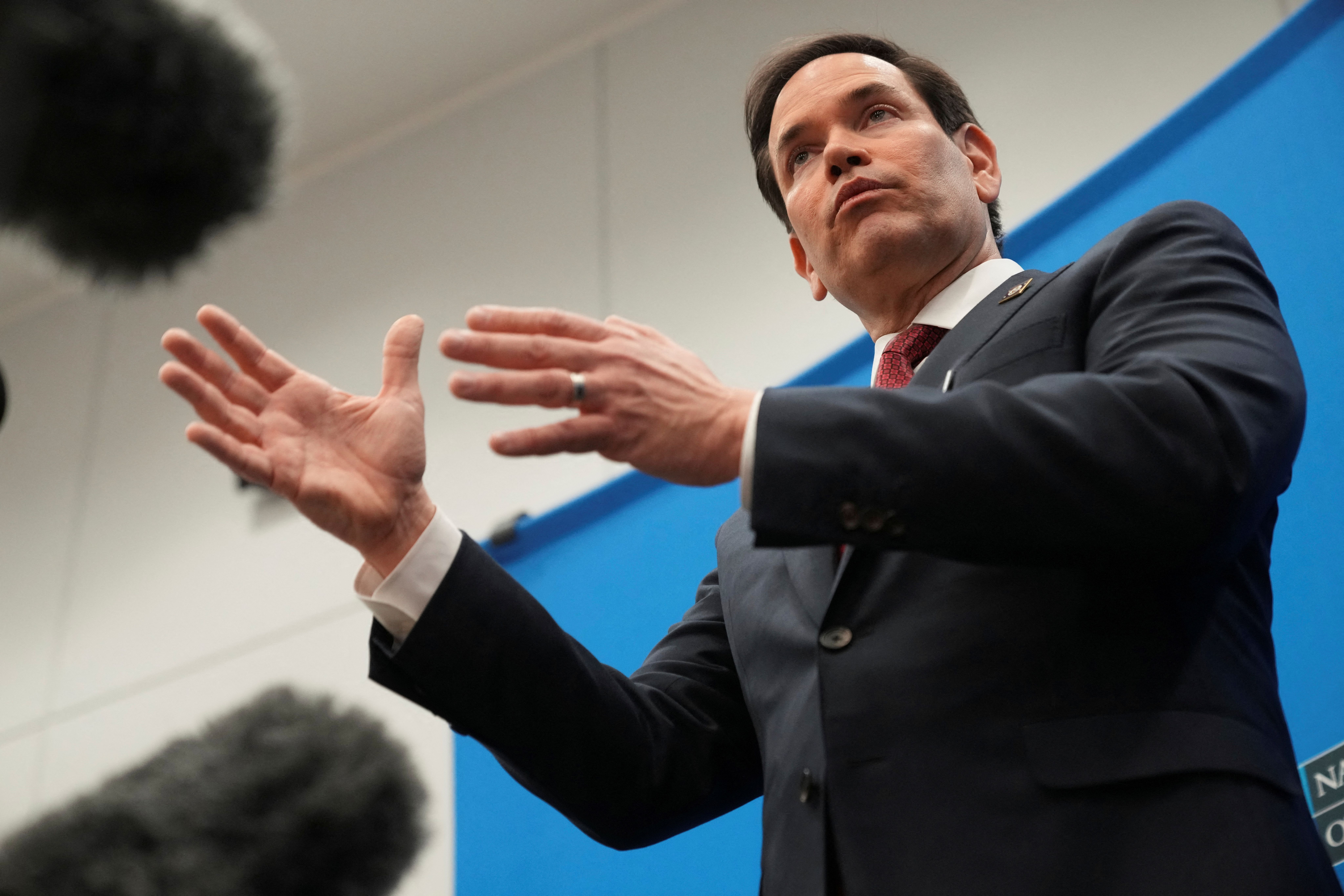 U.S. Secretary of State Marco Rubio talks to reporters at the NATO headquarters in Brussels, Belgium, April 4, 2025.
