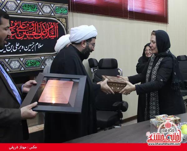 Fatemeh Amin in Tehran being honored by regime officials. Undated