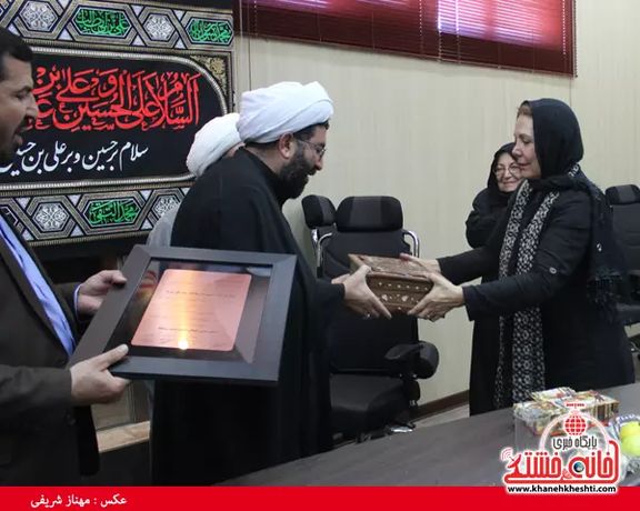 Fatemeh Amin in Tehran being honored by regime officials