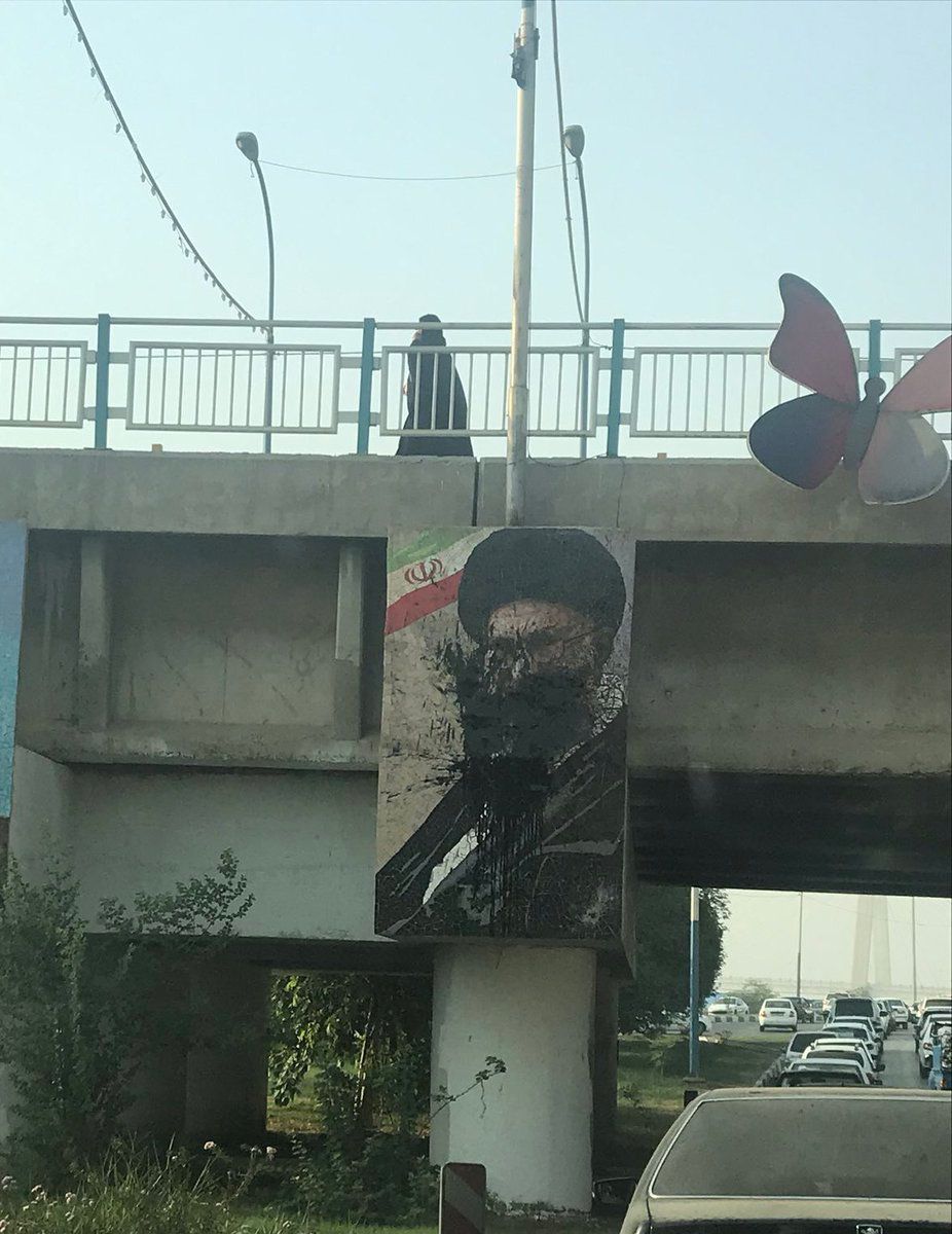 People threw paint on a Khamenei banner during anti-regime protests in October 2022.