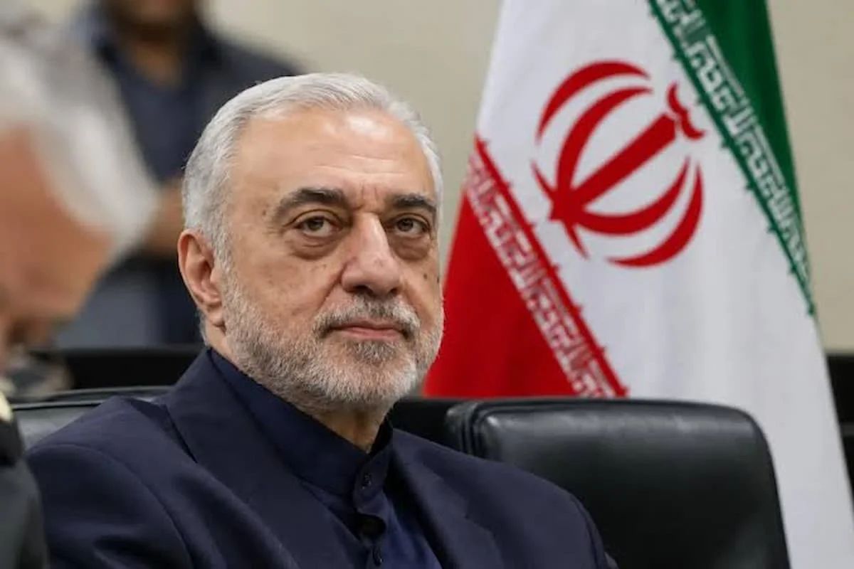 Iran's new Defense Minister Mehrdad Akhlaghi Ketabchi attends an official meeting, with the Islamic Republic's flag behind him.