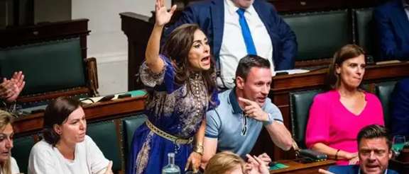 Darya Safai (center) reacts during a plenary session of the Chamber at the Federal Parliament in Brussels in June 2023.