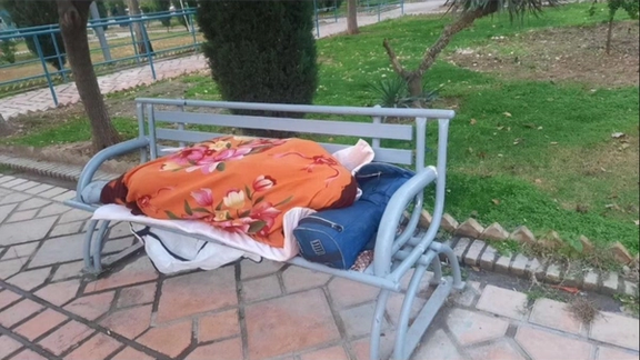 An image circulating on social media shows a retiree who traveled from another province and slept overnight in a Tehran park to attend the protest.