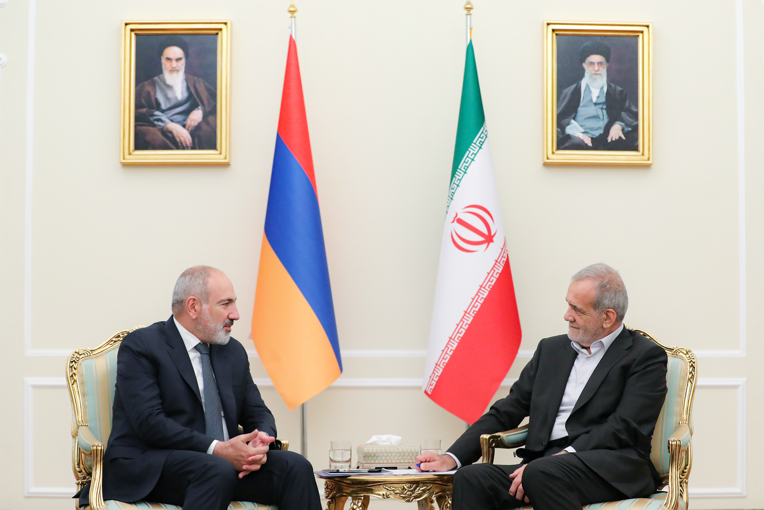 Iran's President Masoud Pezeshkian (right) meets Armenian Prime Minister Nikol Pashinyan in Tehran on July 30, 2024