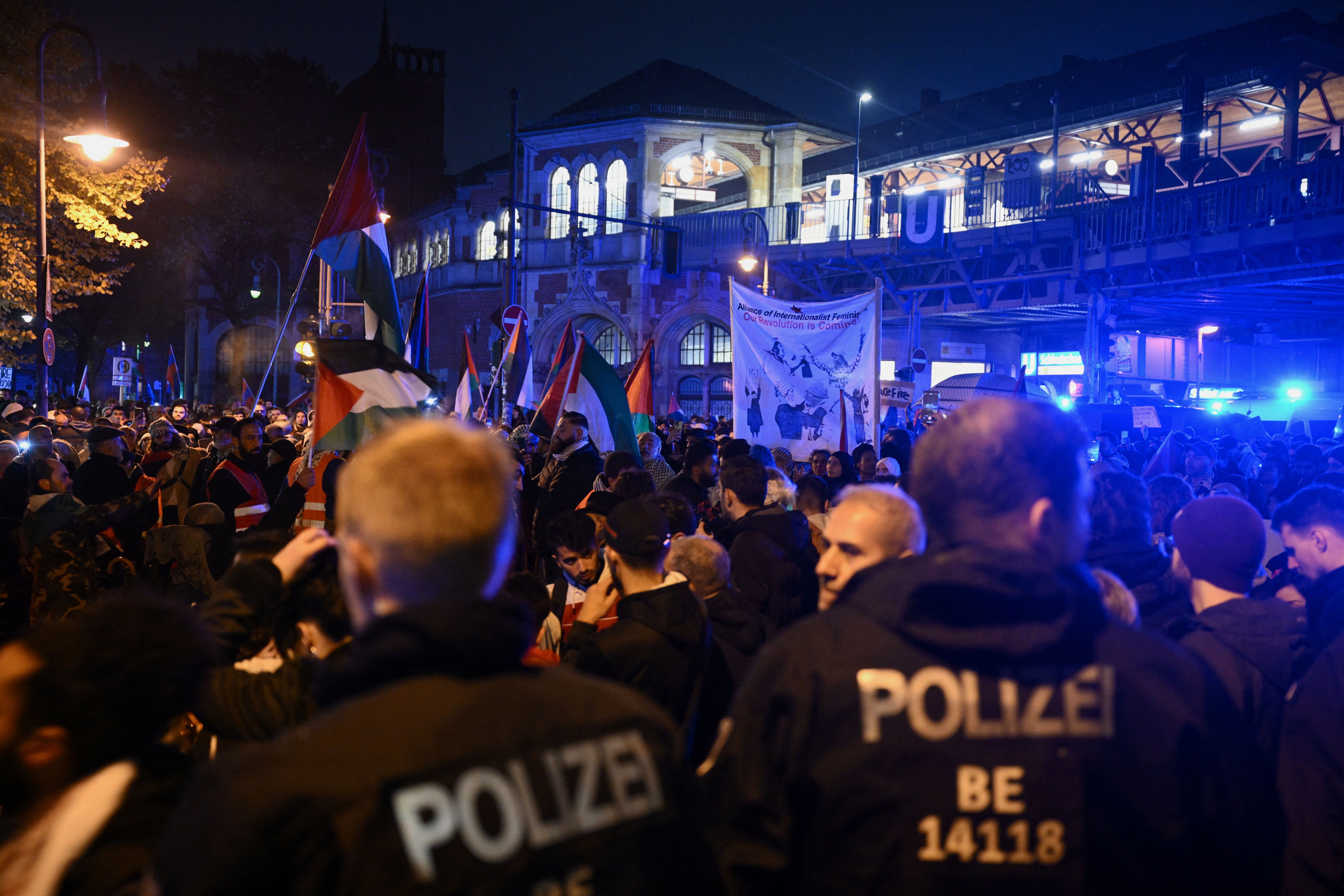Police officers stand guard as people attend a pro-Palestinian demonstration, amid the ongoing conflict between Israel and the Palestinian group Hamas, in Berlin, Germany October 28, 2023. 