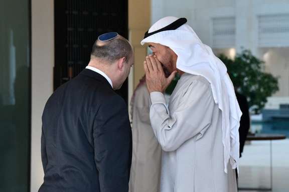 Israeli Prime Minister Naftali Bennett speaks with Bahrain's Foreign Minister Abdullatif Al-Zayani after arriving in Manama, Bahrain, February 14, 2022
