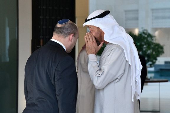 Israeli Prime Minister Naftali Bennett speaks with Bahrain's Foreign Minister Abdullatif Al-Zayani after arriving in Manama, Bahrain, February 14, 2022