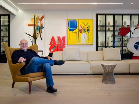 Nazem Said Ahmad in his penthouse in Beirut surrounded by artworks. Undated