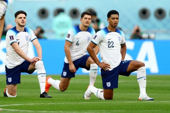 England's Jude Bellingham and Declan Rice take the knee before the match against Iran.