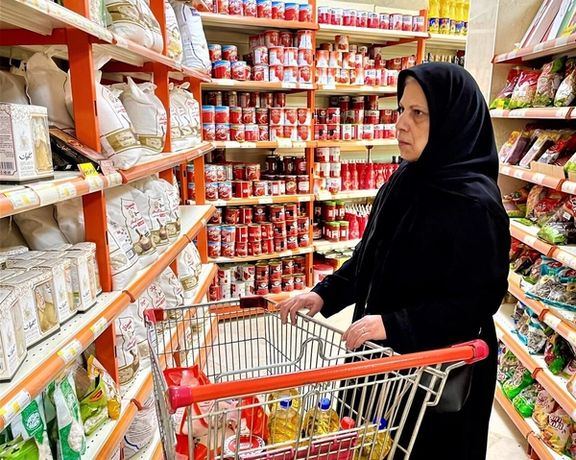 An Iranian shopper browses staple goods in a supermarket as inflation continues to erode purchasing power, pushing food prices further out of reach for many households.