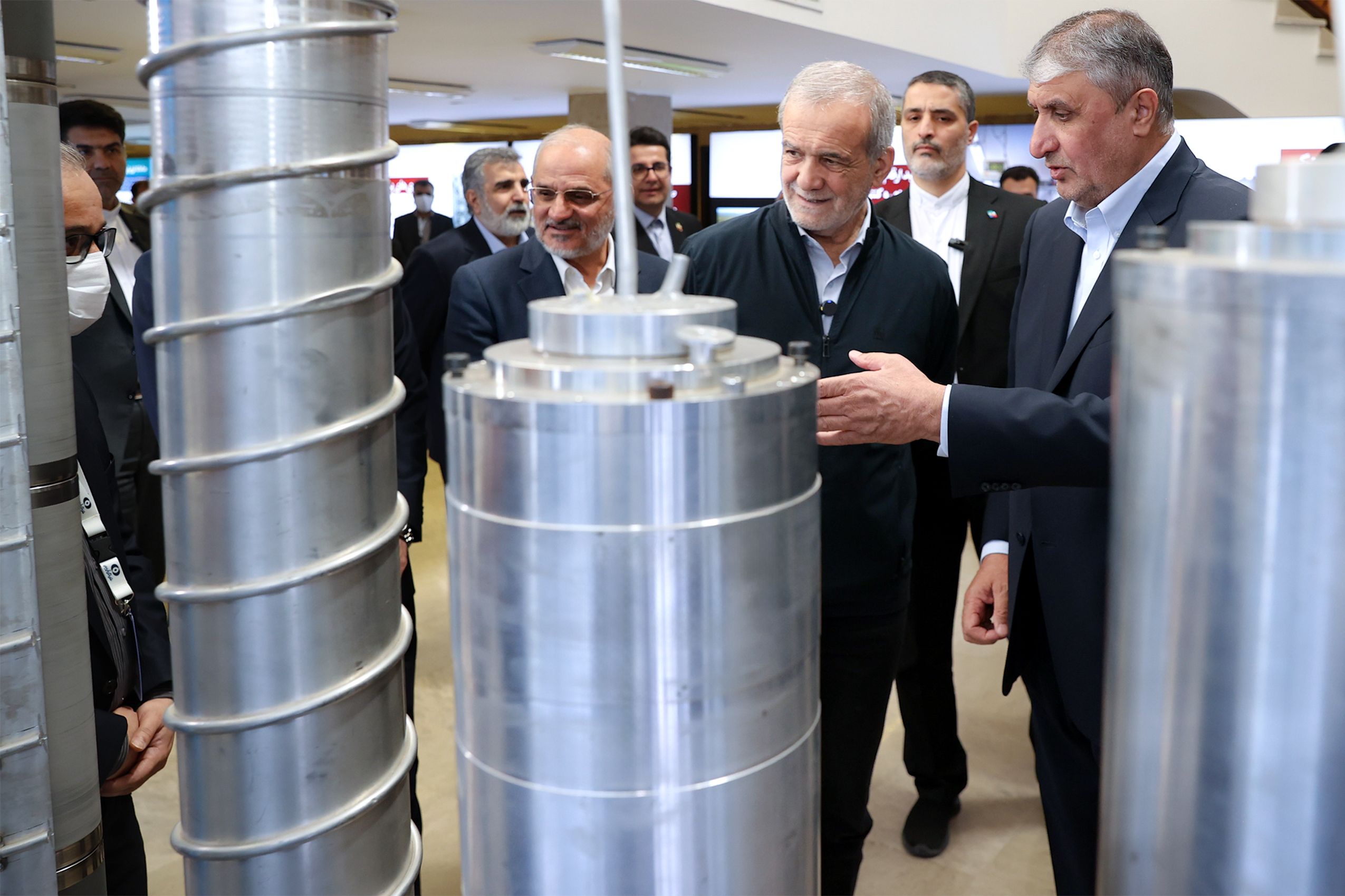 Iran’s nuclear chief Mohammad Eslami (right) and President Masoud Pezeshkian visiting a nuclear expo in Tehran (April 2025)