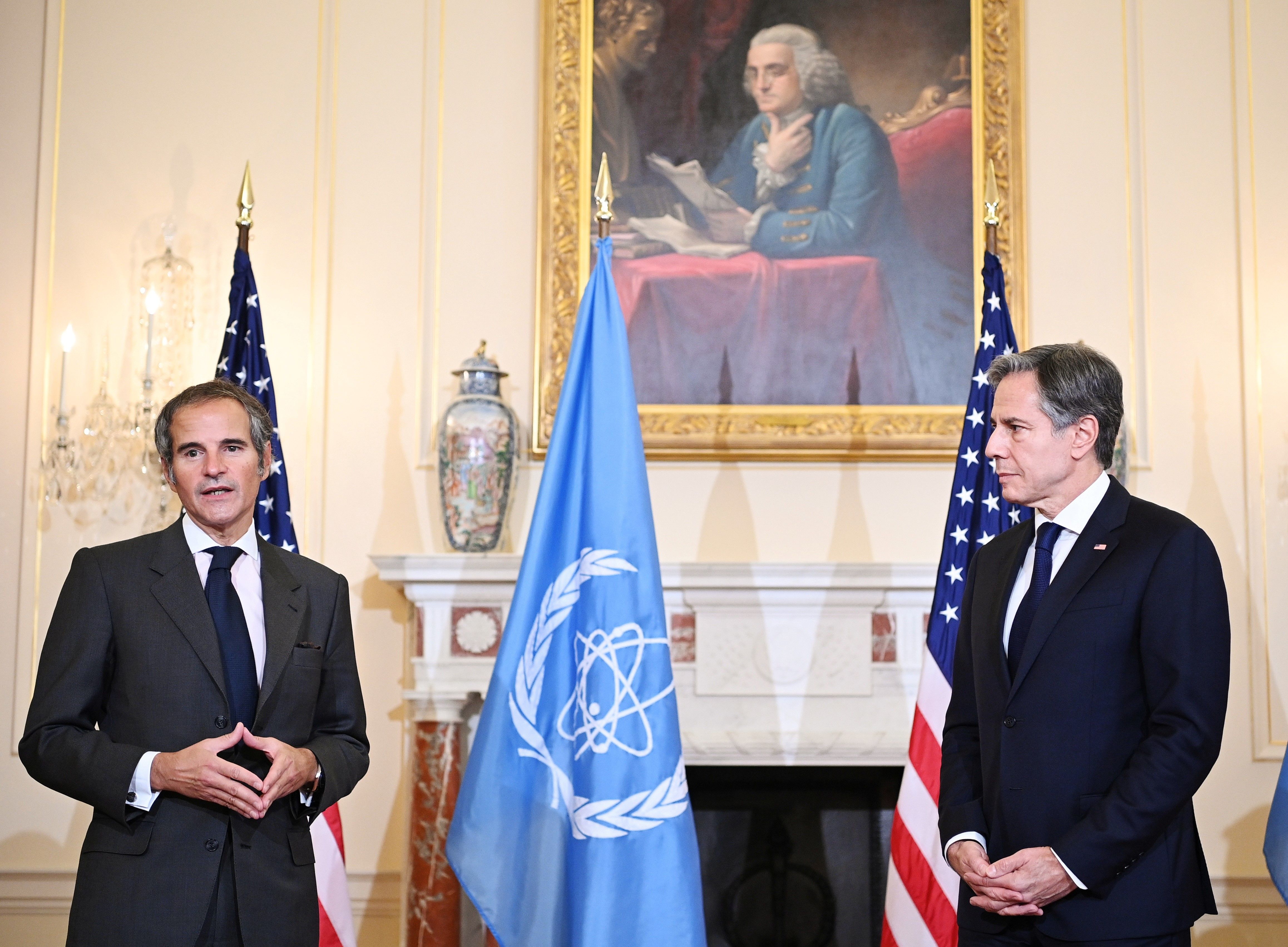 US Secretary of State Antony Blinken (R) listens to IAEA Director General Rafael Grossi speak at the State Department in Washington, D.C. October 18, 2021