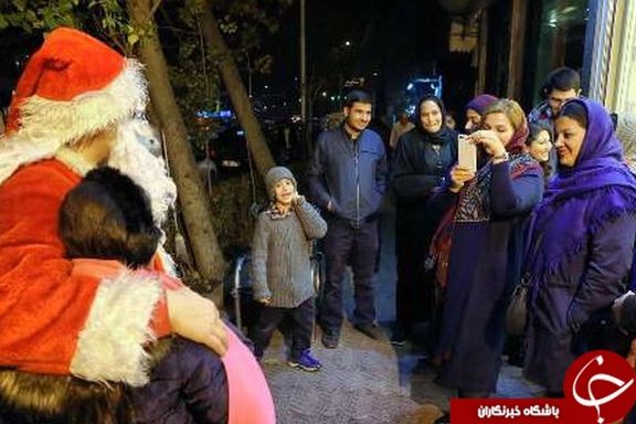 A Santa on a Tehran street greeted by people.