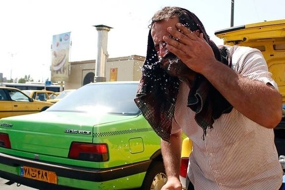 A taxi driver splashes water on his face to find relief from the intense heat during a heatwave in Iran (Undated)