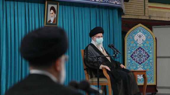Iran's ruler Ali Khamenei speaking on August 30, 2022 while president Raisi is listening