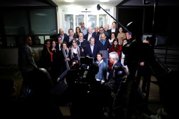 US officials arrange a group photo after freed Americans Siamak Namazi, Morad Tahbaz and Emad Shargi — as well as two other Americans -- who were released in a prisoner swap deal arrived at Davison Army Airfield at Fort Belvoir, Virginia, September 19, 2023.