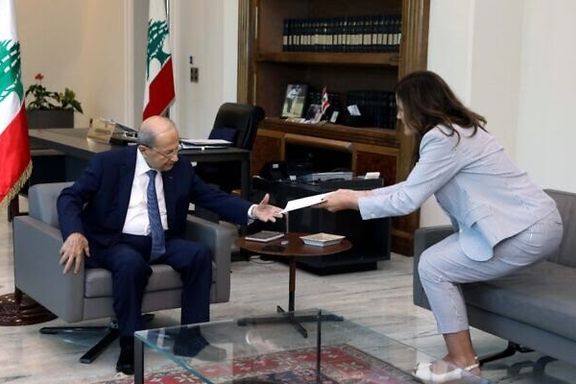 Lebanese President Michel Aoun (left) receives a proposal from US ambassador to Lebanon Dorothy Shea on October 1, 2022