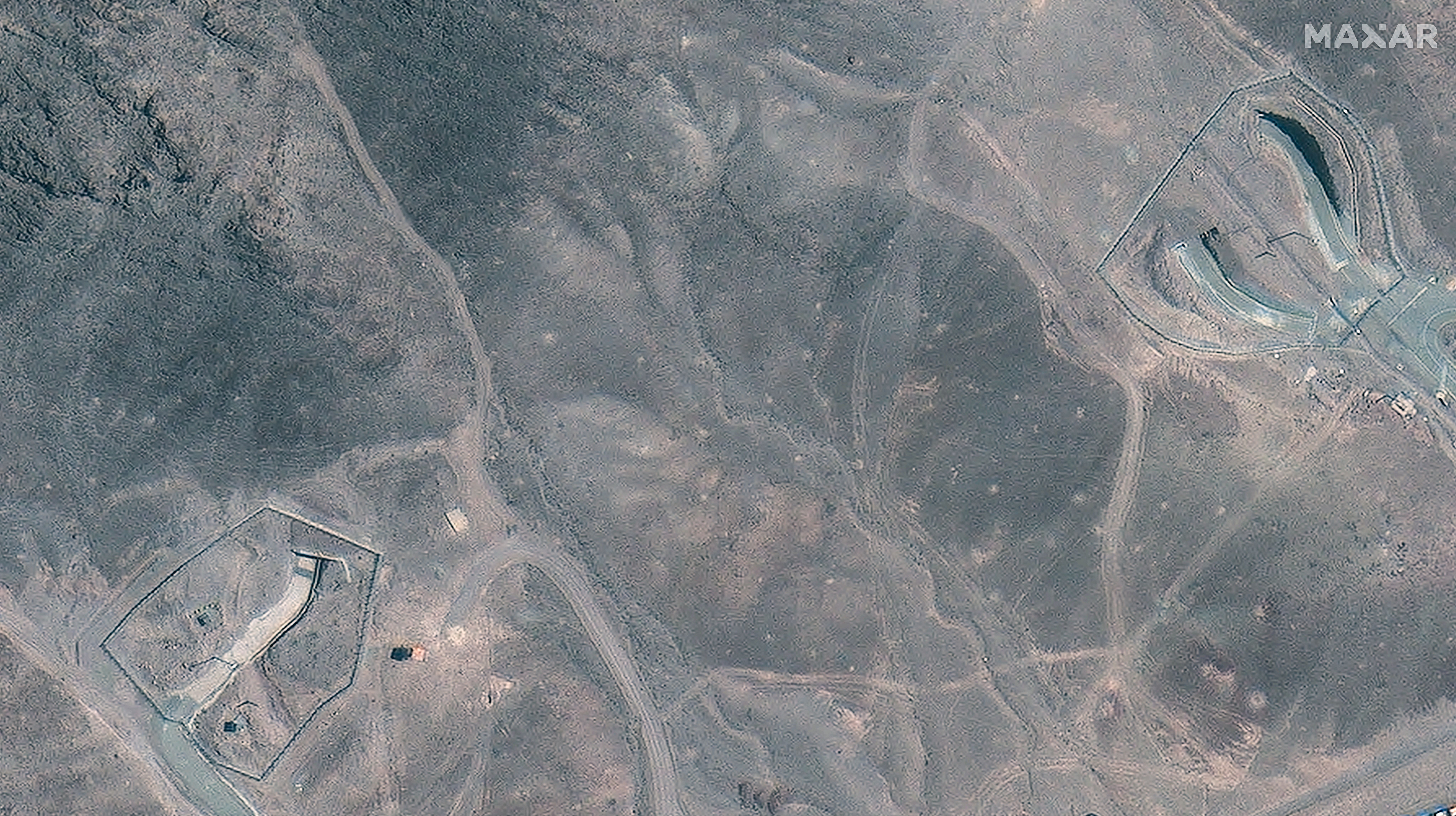 A closer satellite view shows the tunnel entrances to Fordow underground complex, before the US struck the underground nuclear facility, near Qom, Iran June 19, 2025.