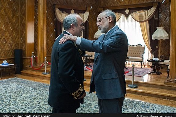 Ali Akbar Salehi, the former head of the Atomic Energy Organization of Iran and a former foreign minister (right)