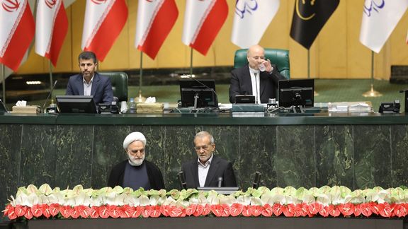 Iran's Chief Justice Gholamhossein Mohseni Ejei and President Masoud Pezeshkian during the swearing-in ceremony in Parliament.