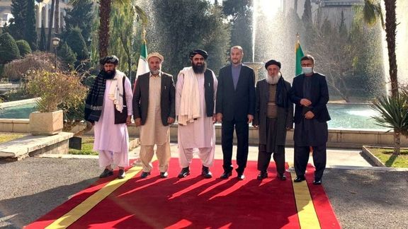 Iranian Foreign Minister Hossein Amir-Abdollahian (4th left) and his Afghani counterpart Amir Khan Muttaqi (3rd left) in Tehran