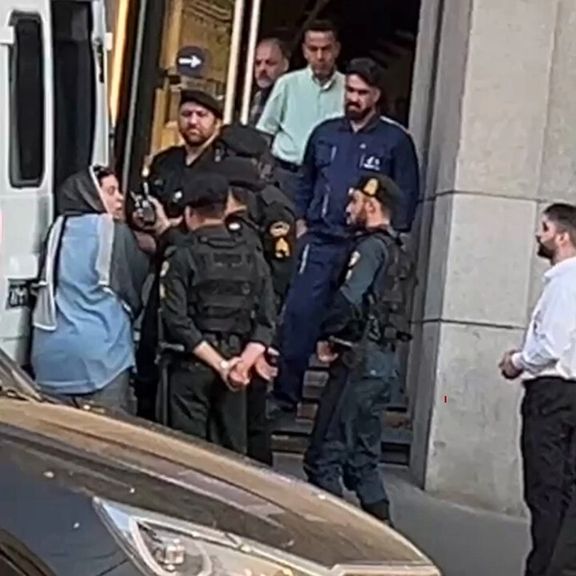 A screengrab from the video of a scuffle between an Iranian woman and hijab police officers in Tehran (April 2024)