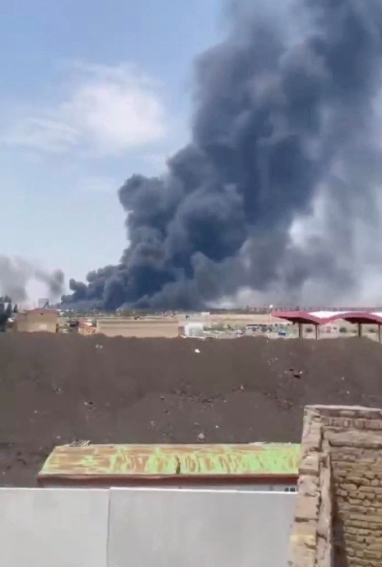 Smoke rises from Tabriz airport in Iran, June 13, 2025 in this screengrab obtained from a social media video. 