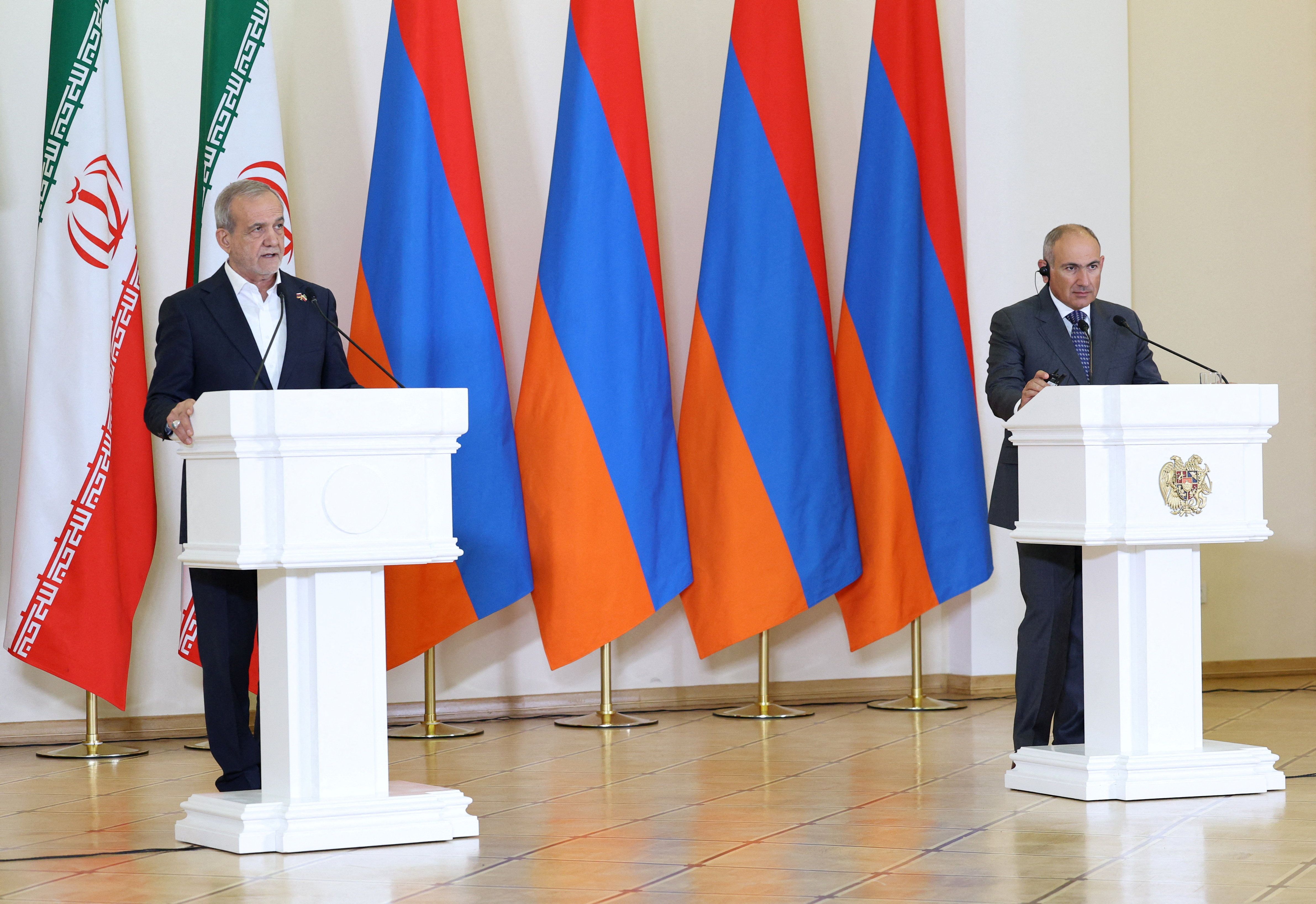 Armenian Prime Minister Nikol Pashinyan and Iranian President Masoud Pezeshkian address the media following their talks in Yerevan, Armenia, August 19, 2025.