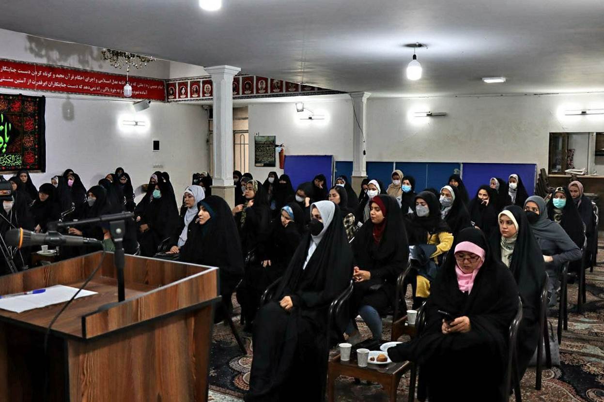 A group wedding of Afghans in Iran. Women sit separate from the men.