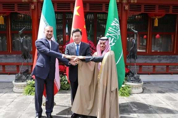 Iranian Foreign Minister Hossein Amir-Abdollahian and Saudi Arabia's Foreign Minister Prince Faisal bin Farhan Al Saud and Chinese Foreign Minister Qin Gang shake hands in Beijing, April 6, 2023