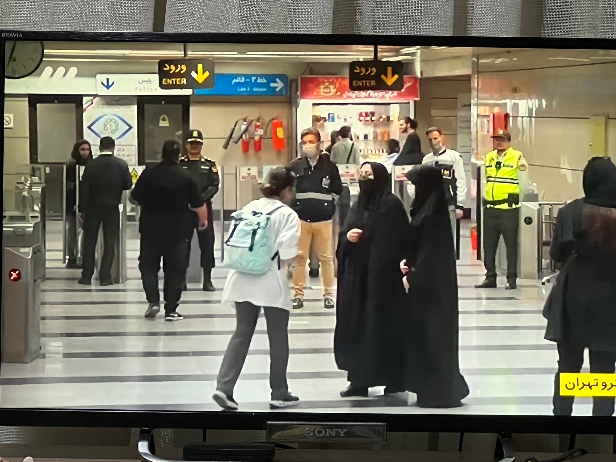 Young woman is stopped by 'hijab patrol' at a Tehran metro station
