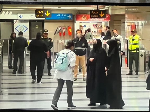 Young woman is stopped by 'hijab patrol' at a Tehran metro station