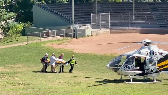 Salman Rushdie being transported to a helicopter to be taken to hospital. August 12, 2022