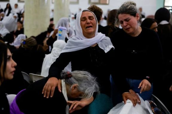 Families whose children were killed at a soccer pitch by a rocket launched across Lebanon's border with Israel react before the funeral in Majdal Shams, a Druze village in the Israeli-occupied Golan Heights, July 28 2024.