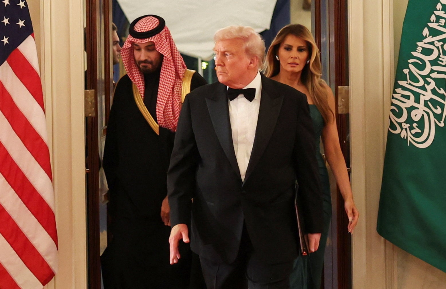 Trump, first lady Melania and MBS arrive for a dinner at the White House, November 18, 2025. 