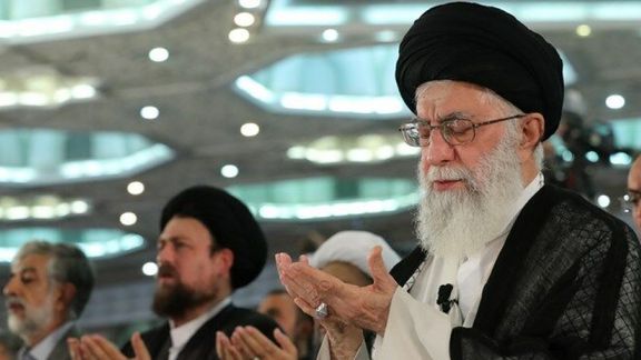 Iran's ruler Ali Khamenei offering prayers on the Muslim Fitr holiday in 2021