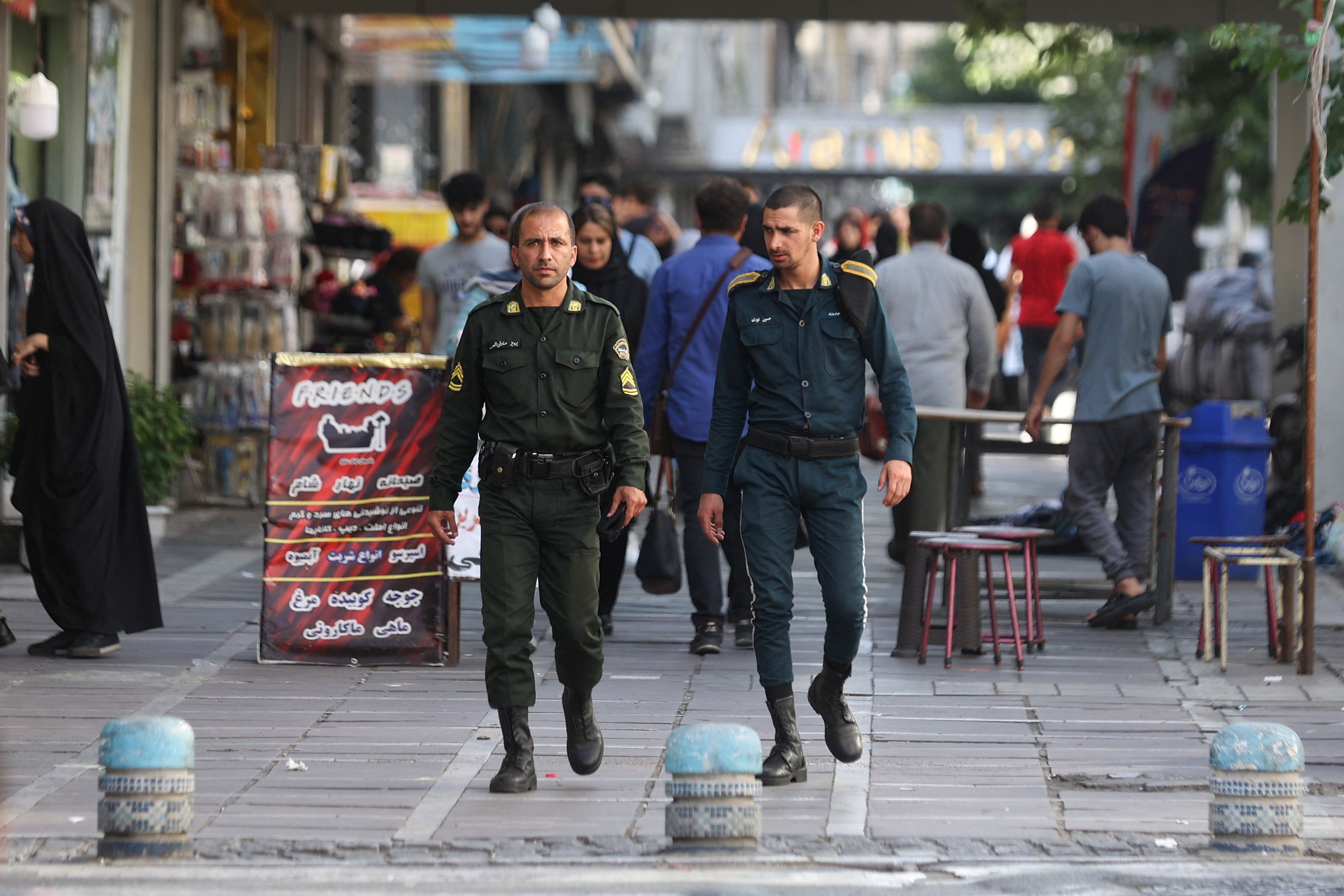 Iran's police forces walk on a street during the revival of morality police in Tehran, Iran, July 16, 2023. 