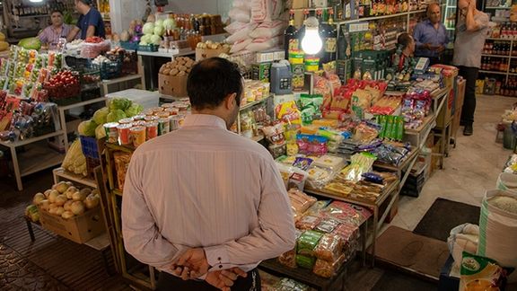 An Iranian man shopping at a bazaar