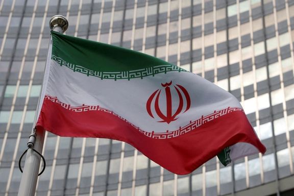 Iran's flag flies in front of the International Atomic Energy Agency (IAEA) headquarters in Vienna, Austria