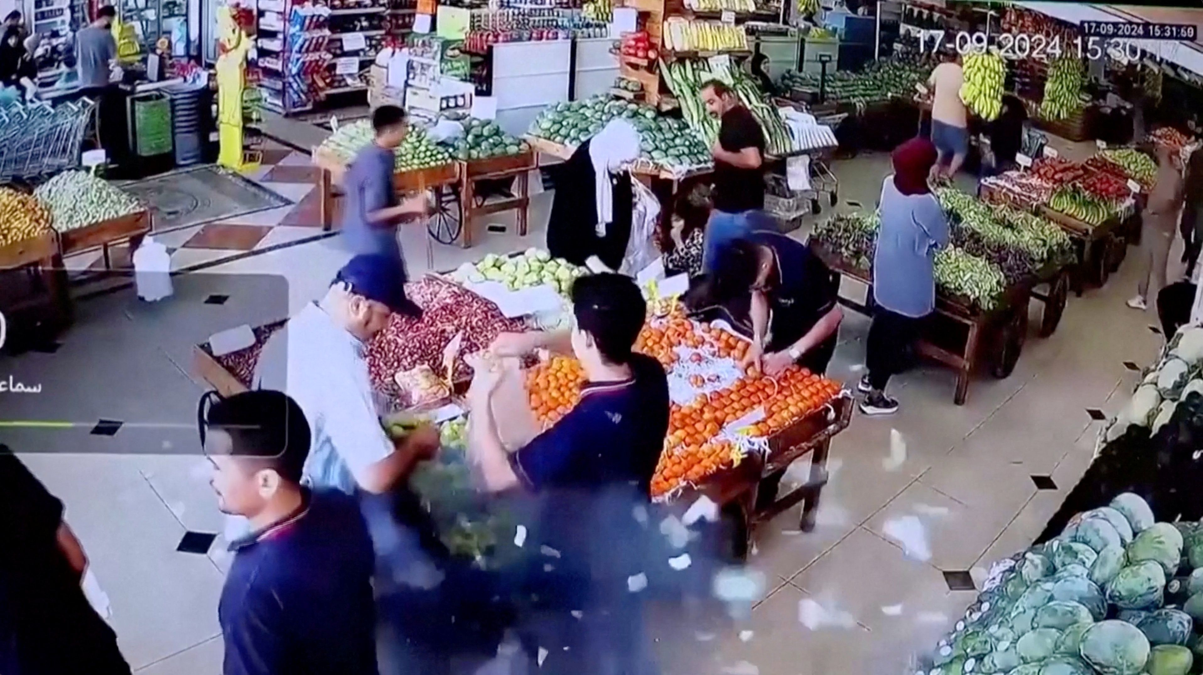 A man's bag explodes in a supermarket in Beirut, Lebanon September 17, 2024 in this screen grab from a video obtained from social media.