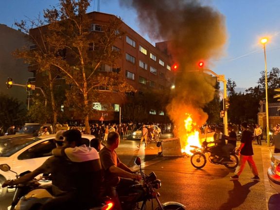 A police motorcycle burns during a protest over the death of Mahsa Amini in Tehran on September 19, 2022.