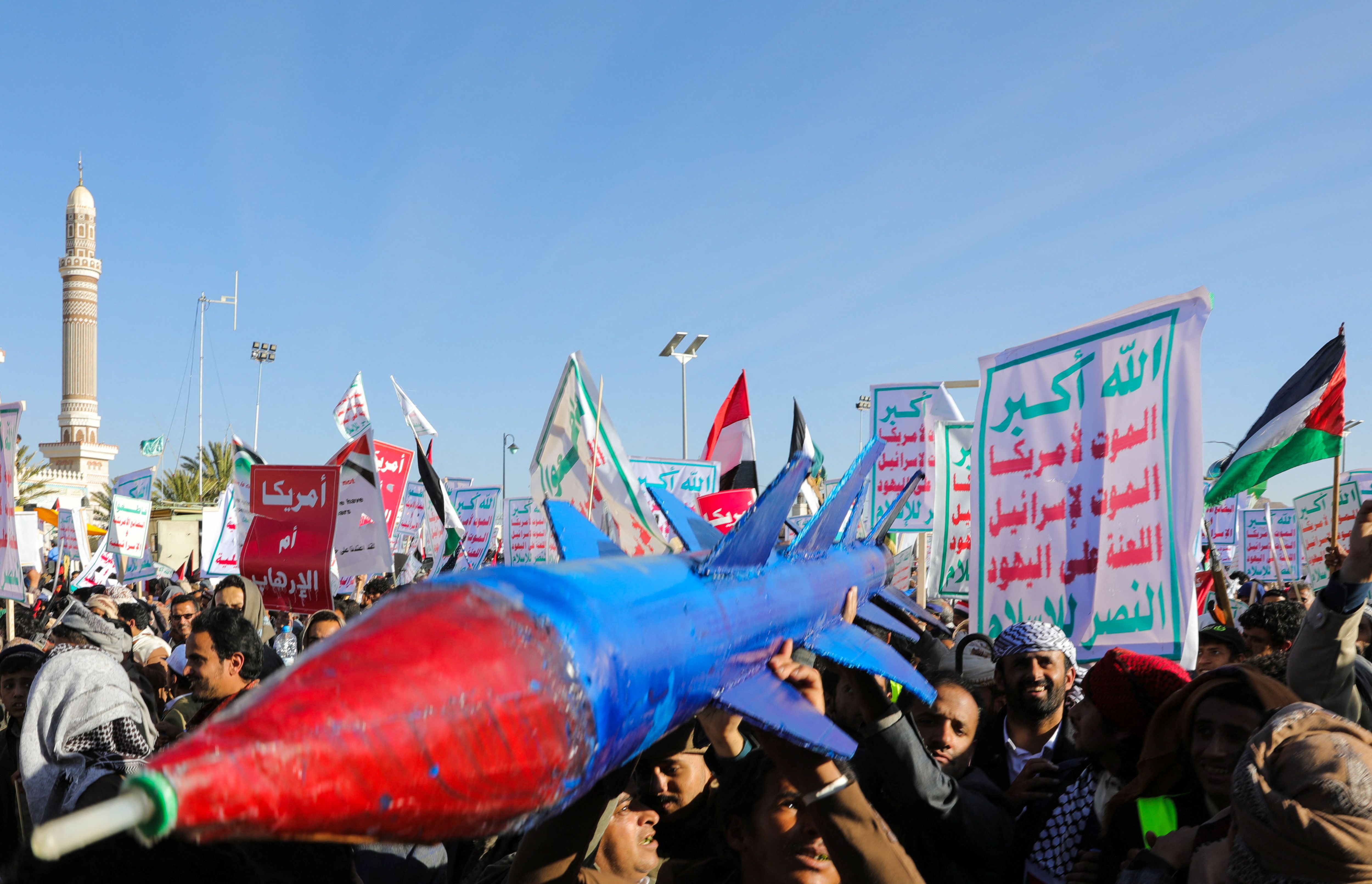 People supporting the Houthis carry a mock missile as they rally against the US-led strikes on Houthi targets, Sana'a, Yemen January 26, 2024. 