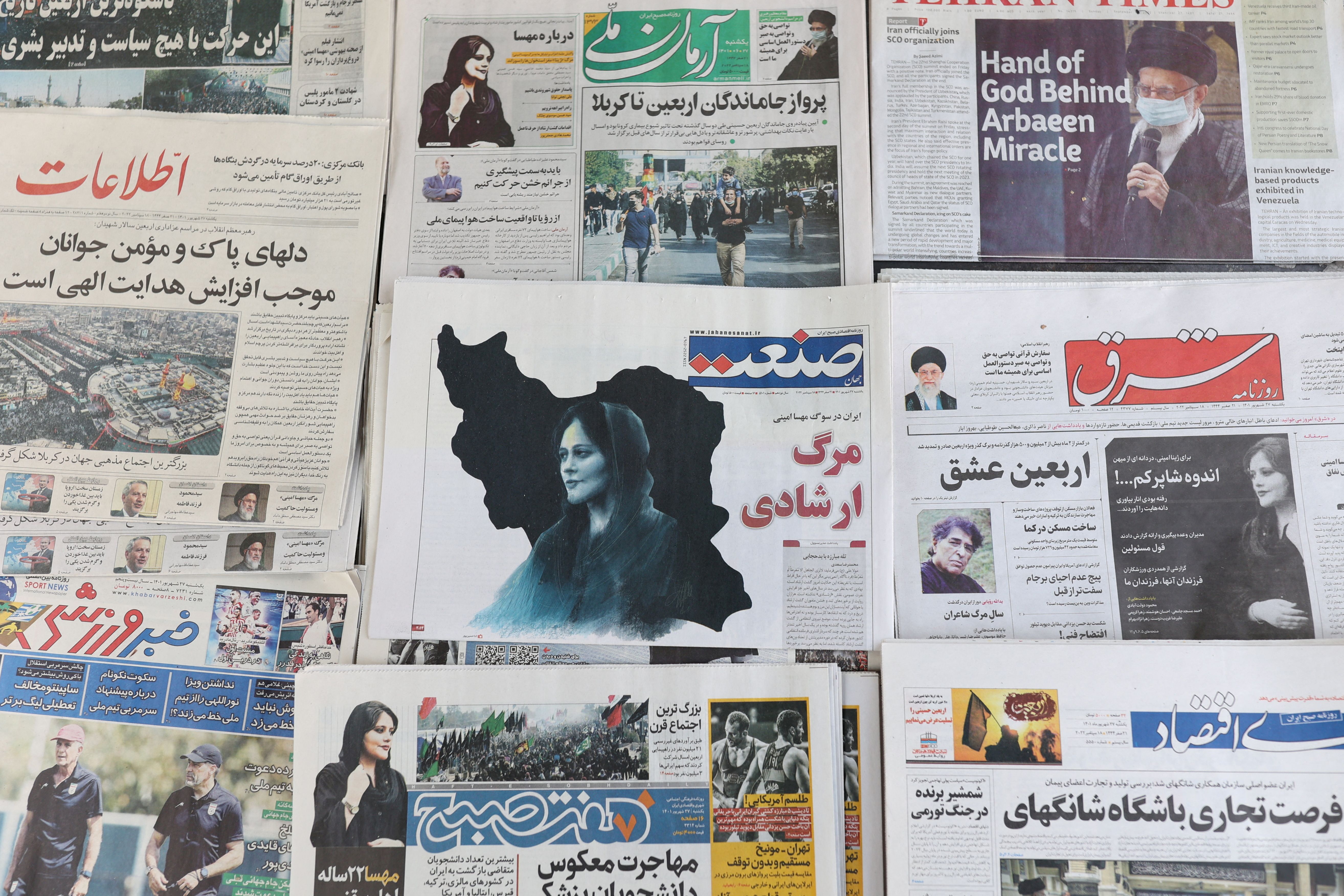 Newspapers, with a cover picture of Mahsa Amini, are seen in Tehran, September 18, 2022.  