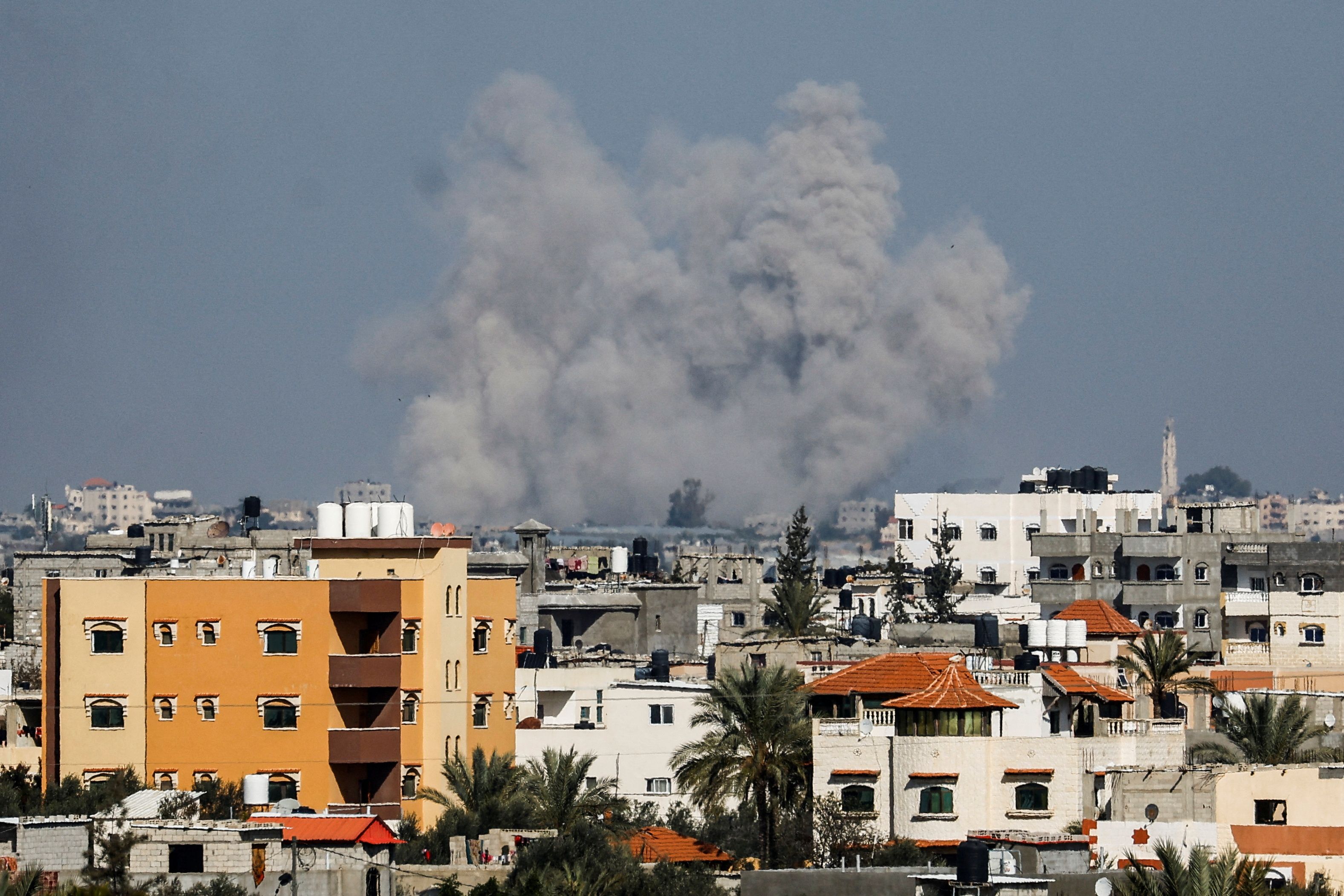 Smoke rises following Israeli strikes, amid the ongoing conflict between Israel and the Palestinian Islamist group Hamas, as seen from Rafah, in the southern Gaza Strip, January 18, 2024. 