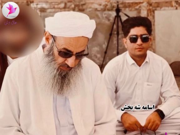 Sunni leader Mowlavi Abdolhamid is seen in a photo with Osameh Shahbakhsh, a cameraman of the Makki Mosque