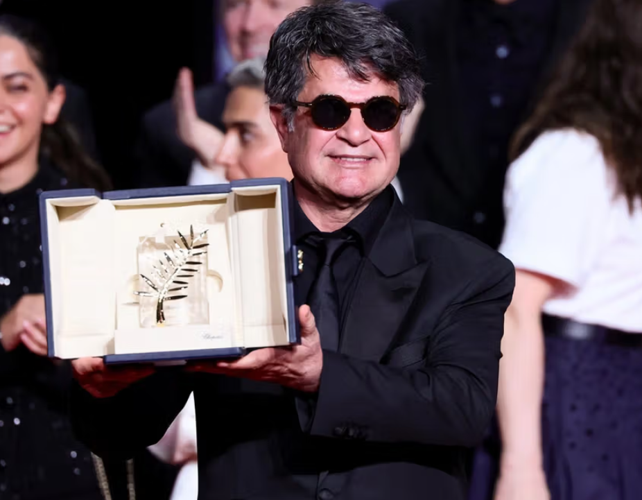 Iranian filmmaker Jafar Panahi holds the Palme d'Or at Cannes after receiving the top award at the Cannes Film Festival, May 24, 2025, France. 