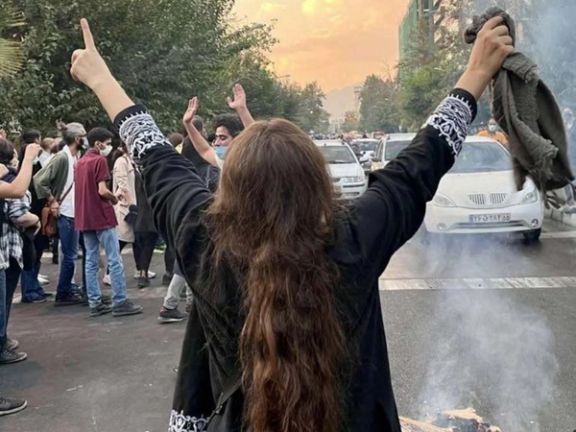 Iranian woman arrested for 'death to dictator' protest, eyewitness says