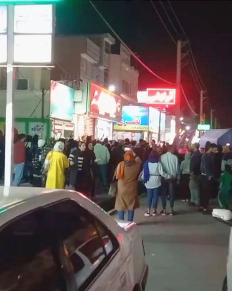 People gather outside the language school that was attacked by Basij plainclothes agents in the city of Eslamshahr in the vicinity of Tehran on February 22, 2023.